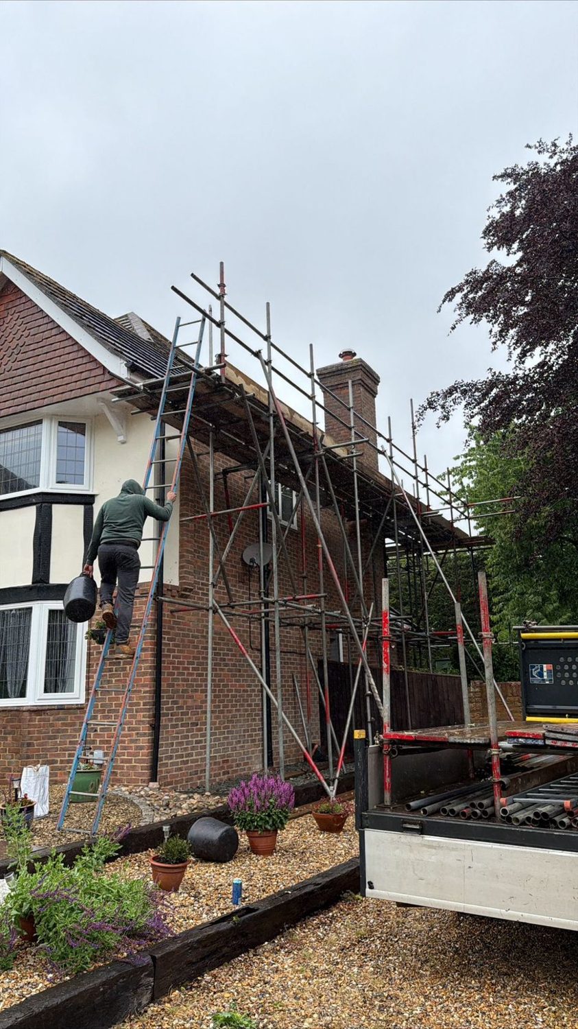 Scaffolder on a detached house re-roof